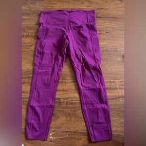 Women’s Lululemon Fast & Free Leggings in Magenta, with pockets. Size 10.